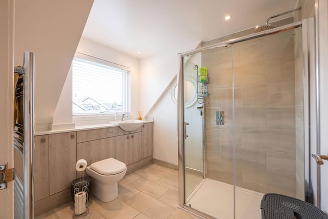 Accommodation on the first floor is completed by a large shower room which is partially tiled.