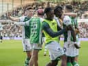 Élie Youan, second right, is mobbed after scoring his second, and Hibs' third against Celtic