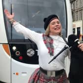 A piper greeted crowds on arrival before playing to passenger on the tram's inaugural journey