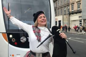 A piper greeted crowds on arrival before playing to passenger on the tram's inaugural journey