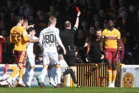 Bevis Mugabi is shown a straight red card by Willie Collum after his foul on Josh Doig. Picture: SNS