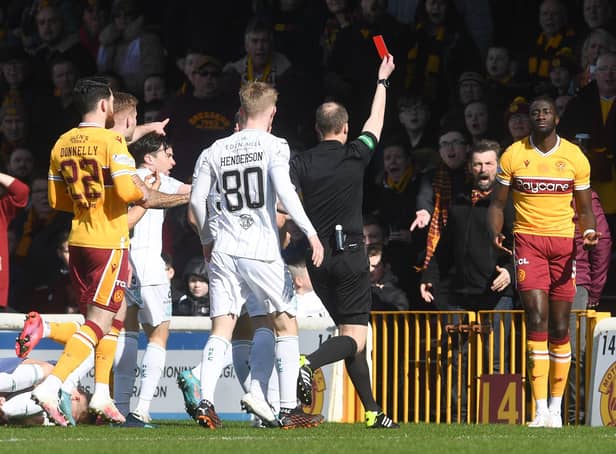 Bevis Mugabi is shown a straight red card by Willie Collum after his foul on Josh Doig. Picture: SNS