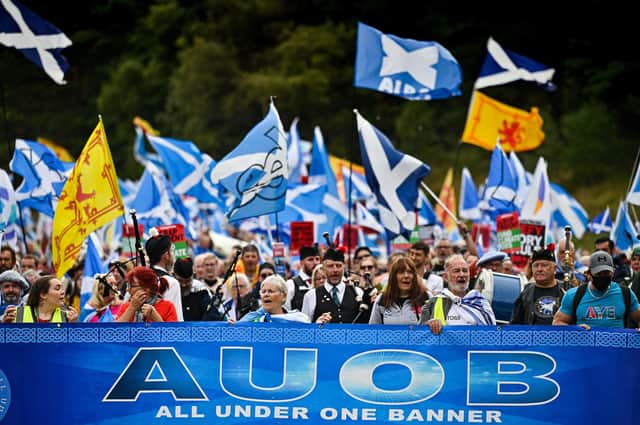 Scottish pro-independence supporters rally outside the Scottish Parliament. The march was organised by All Under One Banner, an umbrella organisation of pro-independence groups that stages large-scale marches throughout Scotland. (Photo by Jeff J Mitchell/Getty Images)