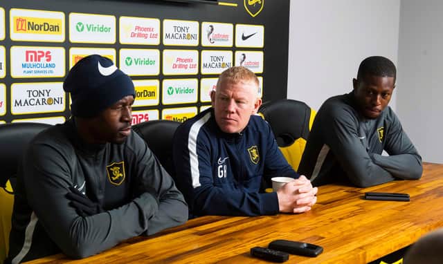 Efe Ambrose (left) and Marvin Bartley either side of Livingston manager Gary Holt. Picture: SNS