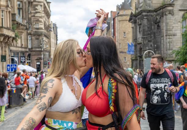 People take part in the Pride Edinburgh 2023 parade through Edinburgh city centre on Saturday June 24, 2023. PA Photo: Lesley Martin/PA Wire