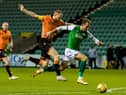 Christian Doidge competes with Mark Reynolds during the last meeting between the two sides