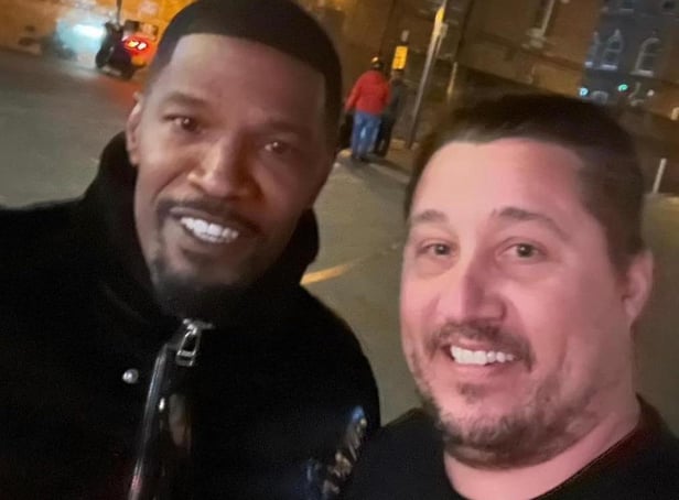 <p>Local man Steven Garbutt grabbed a picture with Jamie Foxx outside the restaurant</p>