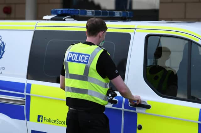 Police have made an arrest after a man was seen acting suspiciously in the Broomhouse area of Edinburgh.