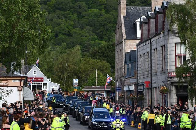 The funeral cortege travels along Ballater, where many counted the late Queen as a neighbour. Picture: Michael Gillen