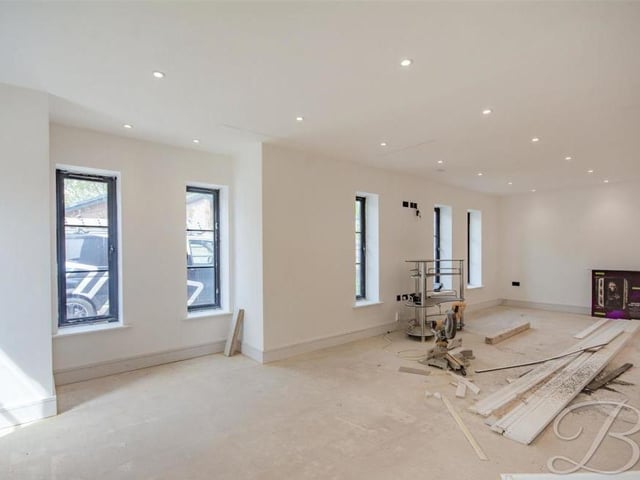 With five windows to the front and two to the side, the property's living room is full of brightness. It's a generous size too and promises to be the hub of the home.