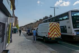A parked van blocked bus stop and cycle land on Leith Walk