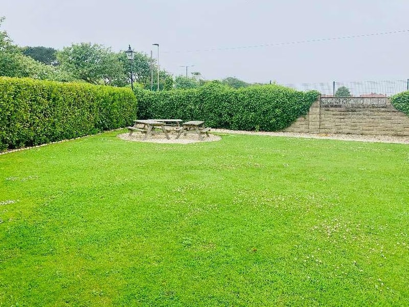 The large lawned garden, complete with outdoor picnic area.