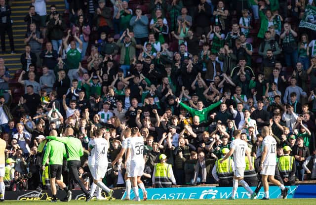 Hibs fans celebrate at full time against Motherwell.