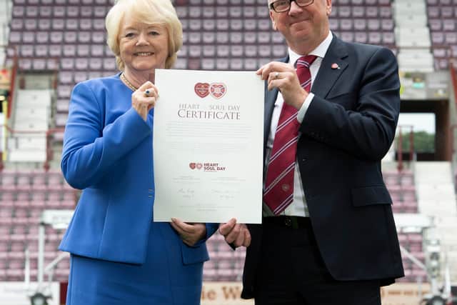 Hearts chairman Ann Budge and Foundation of Hearts chairman Stuart Wallace pictured with the Heart and Soul Day certificate as Hearts officially become the biggest fan-owned club in British football  on August 0