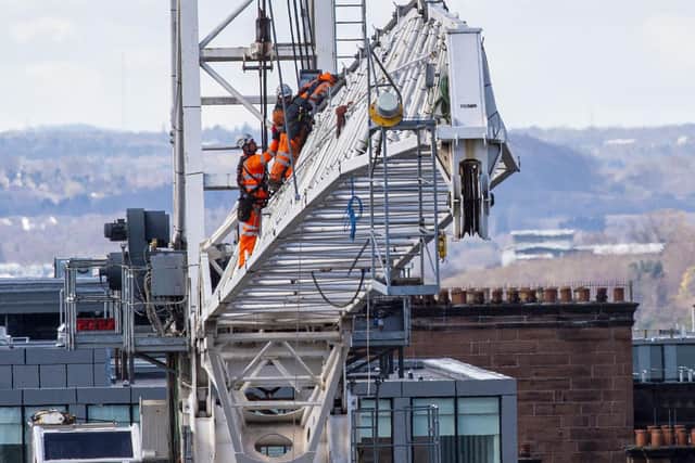Workers taking down the structure on Saturday: Picture: Lisa Ferguson/JPIMedia