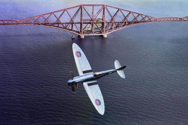 A Spitfire over the Forth, photographed in 1993, conjures up the deadly battle which took place just weeks after the outbreak of the Second World War. Picture: Ian Rutherford.
