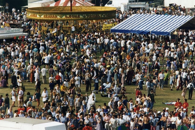Crowds attend Fringe Sunday 1995 at Holyrood Park.