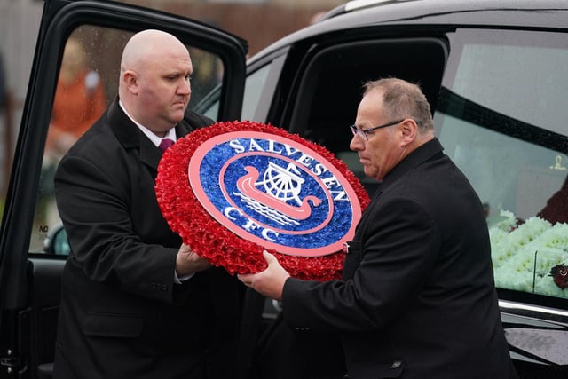 Floral tributes at the funeral of his team Salvesen CFC. Tribute was paid to Hearts fan Andrew while smoke flares of his team were also set off as his cortege passed Tynecastle