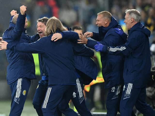 Scotland head coach Steve Clarke (left) celebrates with his staff after the UEFA Nations League draw with Ukraine at the Stadion Cracovii in Krakow. Picture:  Rafal Oleksiewicz/PA