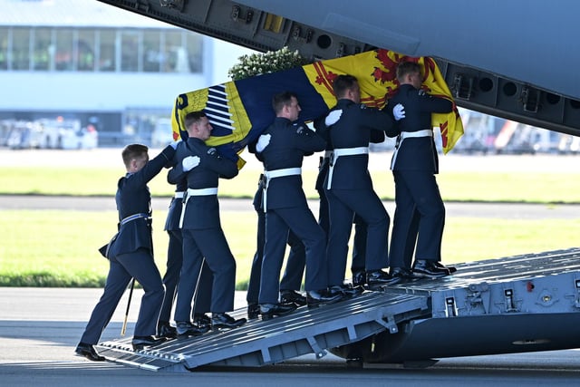 A bearer party from Queen's Colour Squadron of the Royal Air Force (RAF) carry the coffin of Queen Elizabeth II aboard an RAF RAF C17 aircraft on its journey from Edinburgh to Buckingham Palace, London, where it will lie at rest.