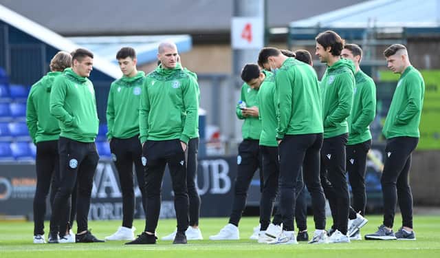 The Hibs squad have a look at the pitch pre-match