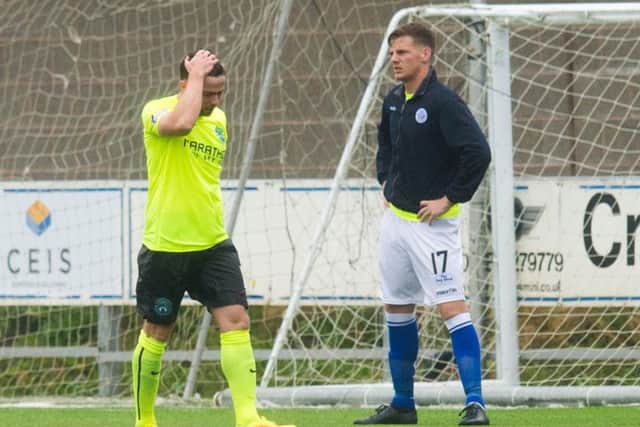 A disconsolate Lewis Stevenson walks off after picking up an early second half red card at Palmerston Park