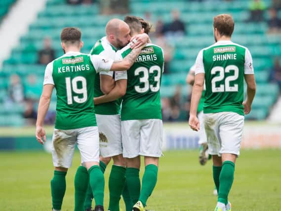 Alex Harris (No 33) is congratulated by his Hibs team-mates after opening the scoring against St Mirren