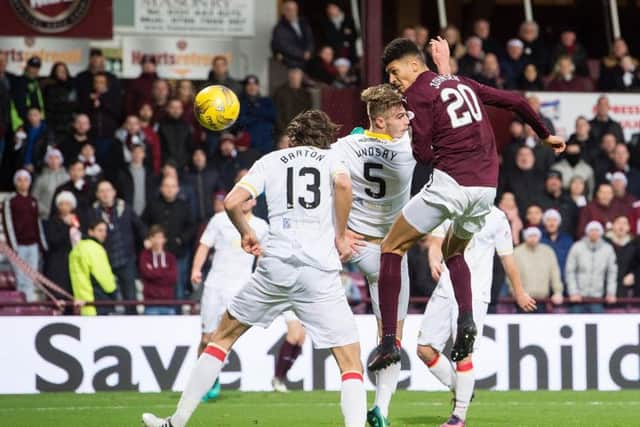 Born Johnsen rises highest to put Hearts 1-0 up against Partick. Pic: SNS