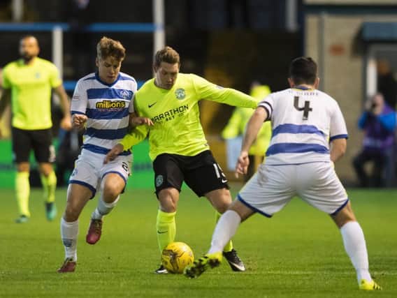 Hibs Kris Commons tries to battle his way between Morton's Andrew Murdoch and Thomas O'Ware (No 4)