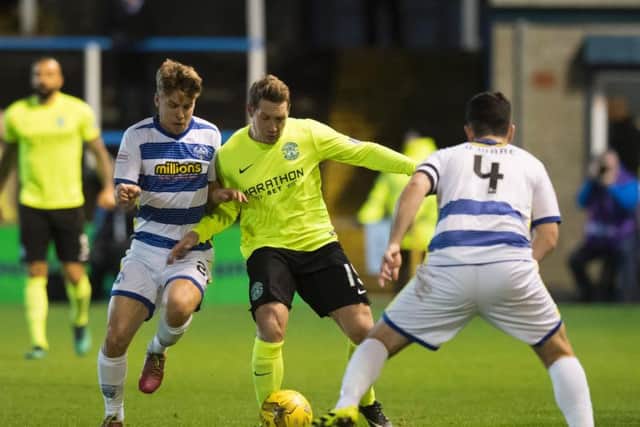 Hibs Kris Commons tries to battle his way between Morton's Andrew Murdoch and Thomas O'Ware (No 4)