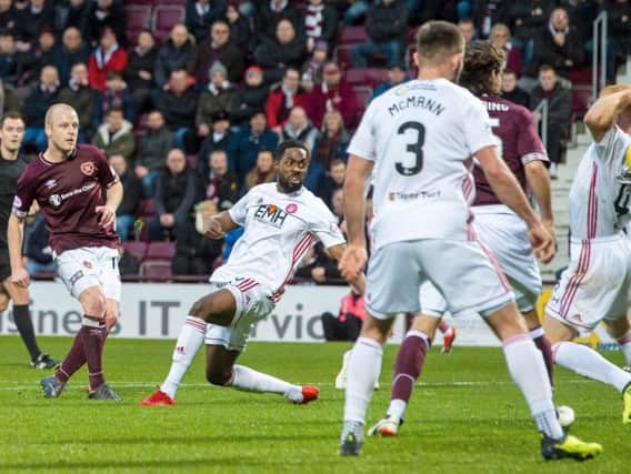 Steven Naismith opens the scoring for Hearts.
