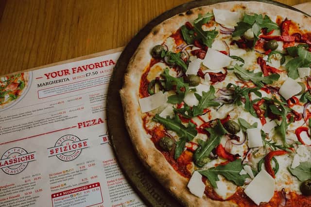 At La Favorita Restaurant and with La Favorita Delivered meat free-loverscan try Fire & Smoke Pizza - fire roasted peppers, smoked mozzarella, green olives, red onion, jalapeos, red chilli peppers & gorgonzola on a tomato base topped with fresh rocket and Parmesan.