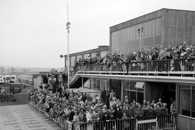 Crowds wave farewell to King Olav of Norway at Turnhouse airport after his state visit to Scotland in October 1962.