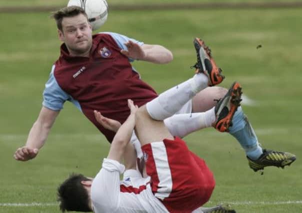 Whitehill Welfare's John Hall takes on Johnny Sealey of Spartans. Picture: TSPL