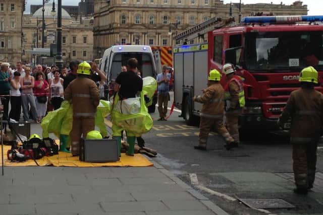 Firefighters outside the Scotsman Hotel today. Picture: Joey Kelly