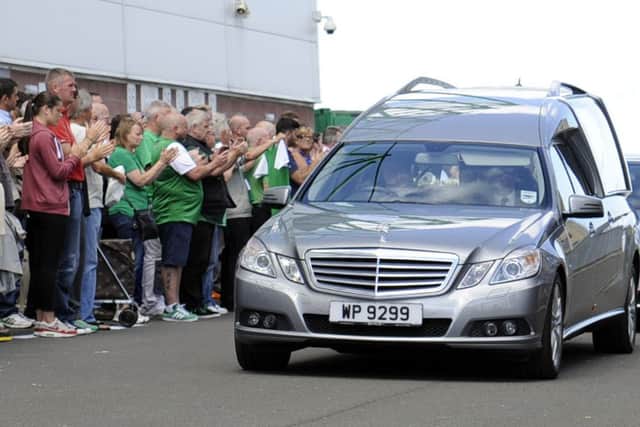 The funeral cortege for  Lawrie  Reilly passes by Easter Road stadium this lunchtime. Pic: Phil Wilkinson