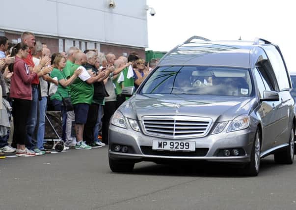 The funeral cortege for  Lawrie  Reilly passes by Easter Road stadium this lunchtime. Pic: Phil Wilkinson