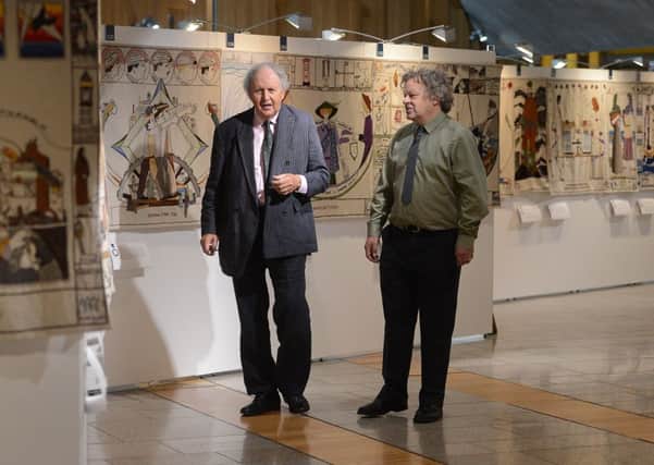 Alexander McCall Smith and Andrew Crummy with the tapestry. Picture: Neil Hanna