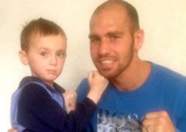 Jayden Nicol with boxer Stephen Simmons, who auctioned off his gloves for the cause. Picture: comp