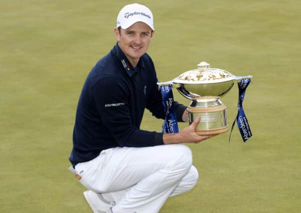 Justin Rose poses with the trophy
 after winning the Scottish Open at Royal Aberdeen