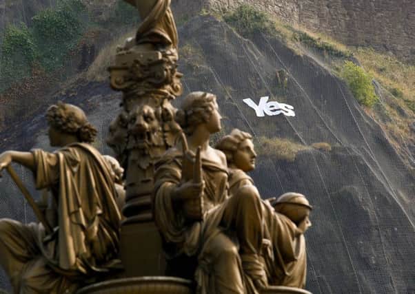 A "YES" campaign banner on Edinburgh Castle rock. Pic: Scott Louden