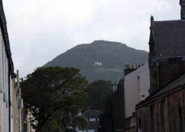 A Yes sign put on the side of North Berwick Law by campaign group the Hills Have Ayes. Pic: @HillsHaveAyes