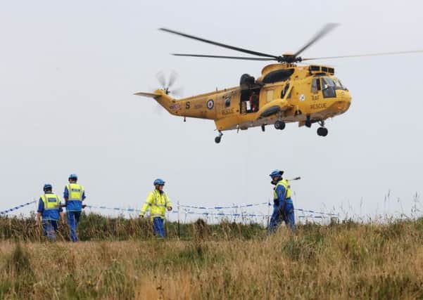 Emergency services were launched after a helicopter crashed into the sea near the cliffs at Flamborough Head, East Yorks. Pic: Ross Parry/SWNS