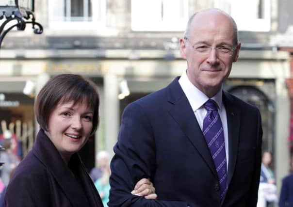 John Swinney arrives at St Giles Cathedral with his wife Elizabeth Quigley