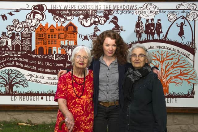 Heather Goodare, artist Astrid Jaekel and poet Rachel Woolf in front of the Meadows mural. Picture: Lesley Martin