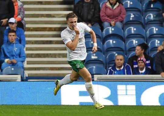 Jason Cummings celebrates his opening goal for Hibernian. Pic: SNS Group Sammy Turner