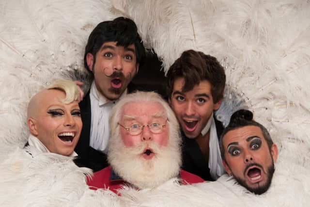 Santa is joined by Australian performing group Briefs to help launch Edinburgh's Christmas. Picture: Andrew O'Brien