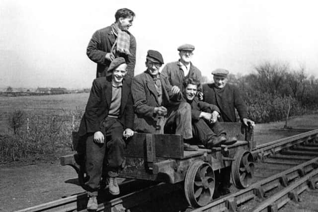 A group of railwaymen on their trolley. Picture: comp