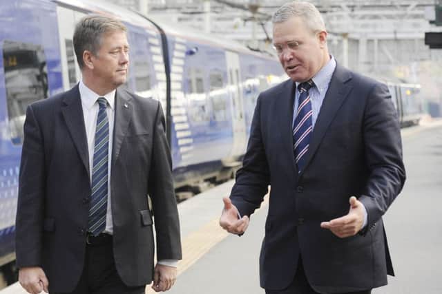 Keith Brown and Abellio chief executive Jeff Hoogesteger. Picture: Greg Macvean