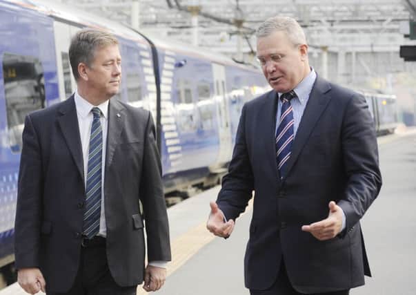 Keith Brown and Abellio chief executive Jeff Hoogesteger. Picture: Greg Macvean